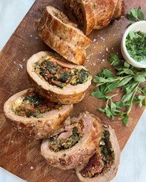 Stuffed pork tenderloin with spinach, mozzarella, roasted red peppers, and pesto
