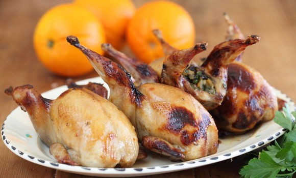 Stuffed quail with raisins, orange and herbs