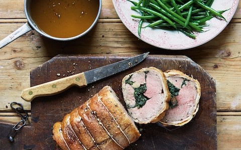 Stuffed saddle of lamb with spinach and garlic, saffron jus