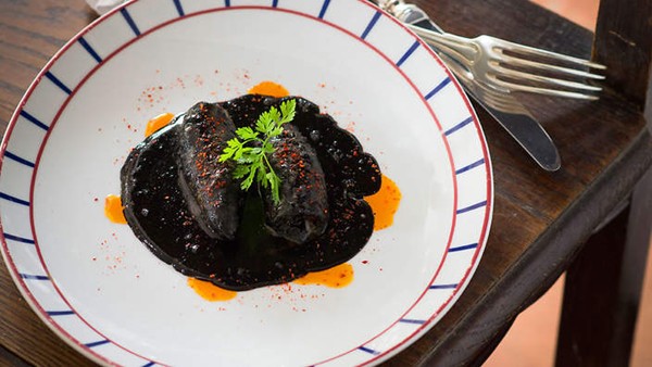 Stuffed squid in black ink sauce (Encornets farcis à l'encre de seiche)