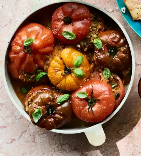Stuffed tomatoes with capers, pine nuts and currants