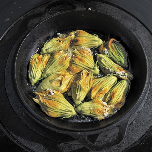 Stuffed zucchini blossoms in tomato sauce