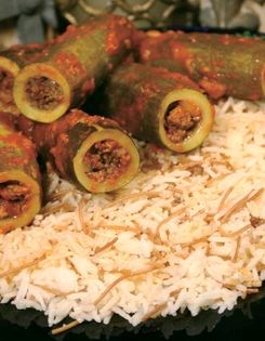 Stuffed zucchini in tomato sauce (Kablama bi banadora)