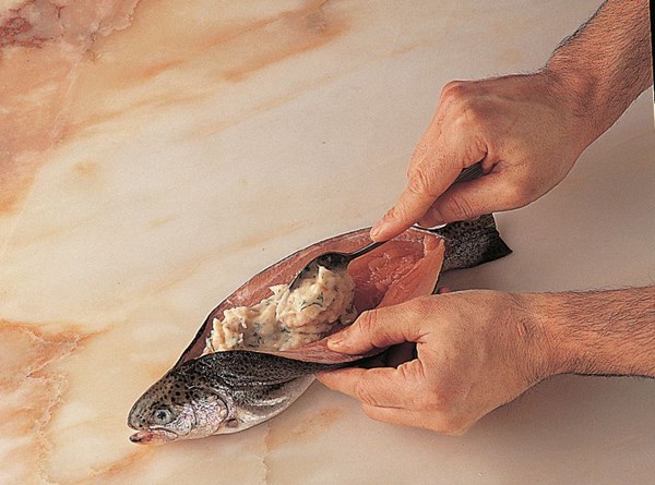 Stuffing through the back of the fish before baking