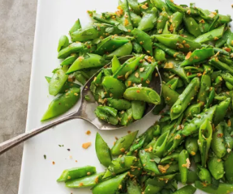 Sugar snap peas with almonds, coriander, and orange zest