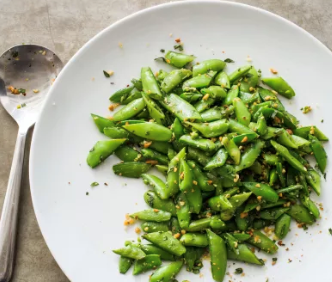 Sugar snap peas with pine nuts, fennel, and lemon zest