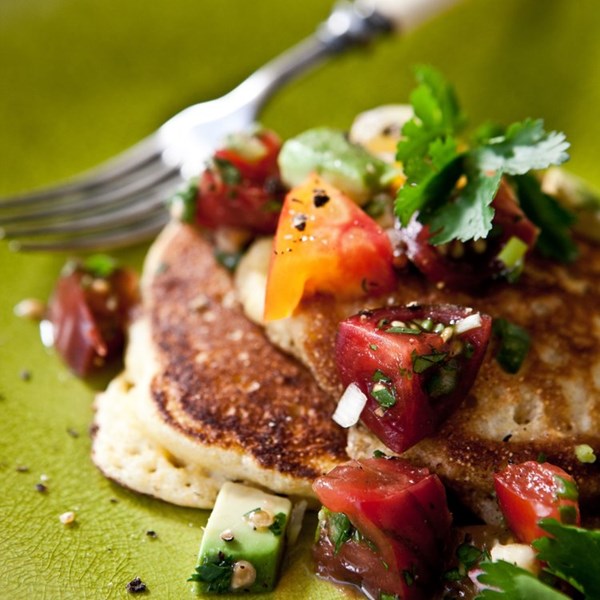Summer corn cakes with chopped tomato and avocado salsa