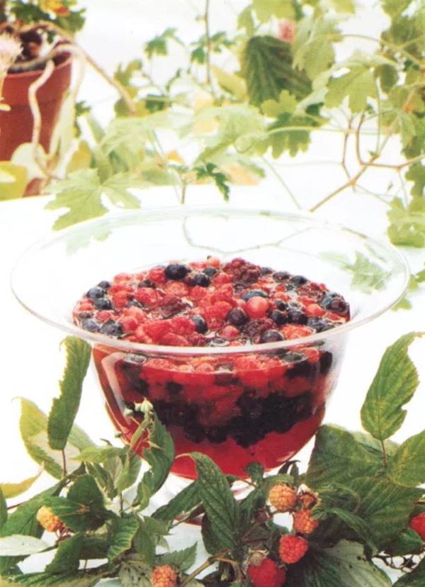 Summer fruit salad with sweet geranium leaves