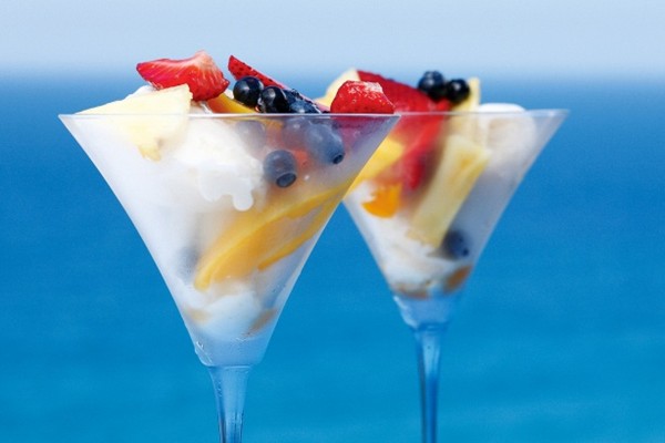 Summer fruits in jasmine tea syrup with coconut cakes and ginger ice cream