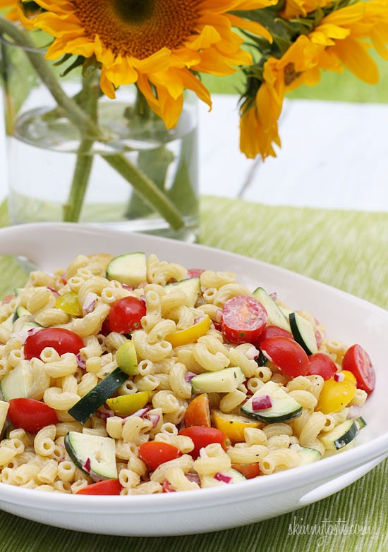 Summer macaroni salad with tomatoes and zucchini