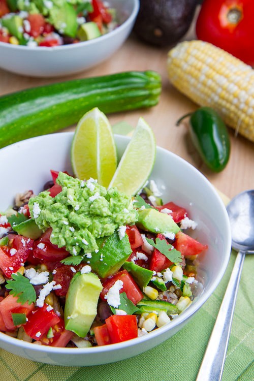 Summer vegetable quinoa burrito bowls with corn, zucchini and black beans