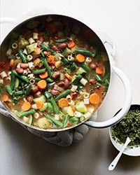 Summer vegetable soup with carrot top-pumpkin seed pistou