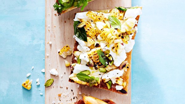 Summer vegetable tartines: corn, feta, and pistachio