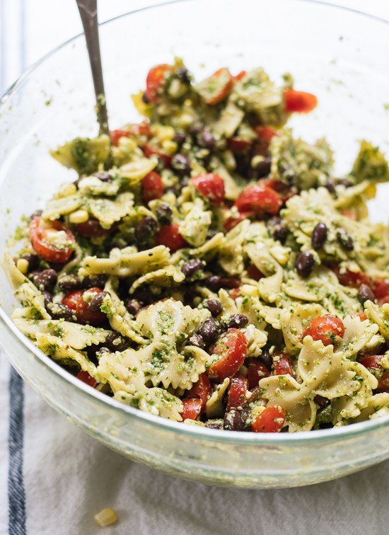 Summertime pasta salad with tomatoes, corn and jalapeño pesto