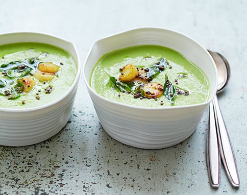 Summery pea soup with turmeric scallops