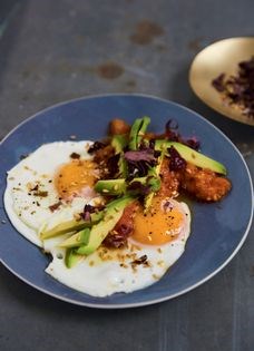 Sunny-side-up eggs with flax crunch and tomato chutney