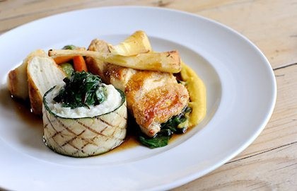 Suprême of chicken with truffled sausage, potato purée with leeks, roasted vegetables and tarragon jus