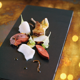 Surf 'n' turf: cod & squab with braised cabbage & Jerusalem artichokes