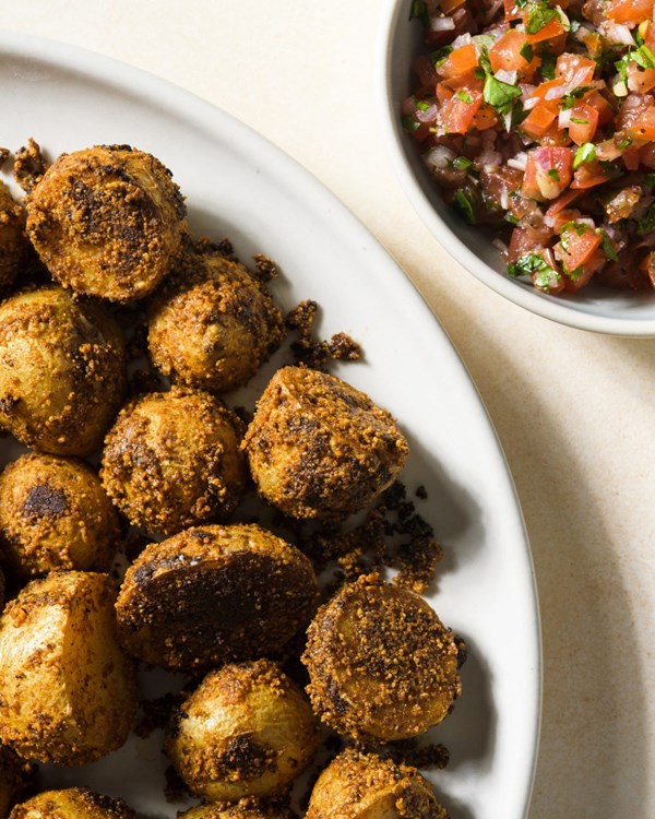 Suya-spiced roasted potatoes with tomato-chili relish