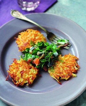 Swede and pear latkes with pickled herring, smoked salmon, parsley and dill salad
