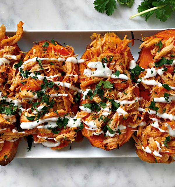 Sweet & spicy chicken stuffed sweet potatoes