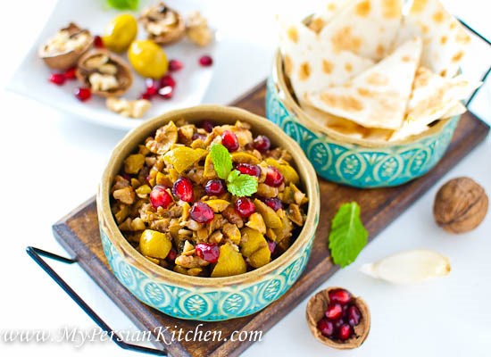 Sweet and salty marinated olives in pomegranate molasses and crushed walnuts (Zeytoon parvardeh)