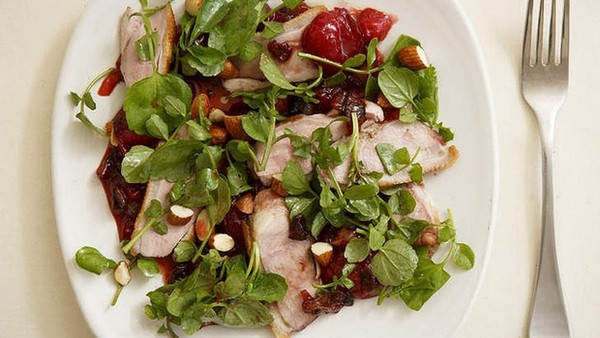 Sweet and sour duck salad with plums and almonds