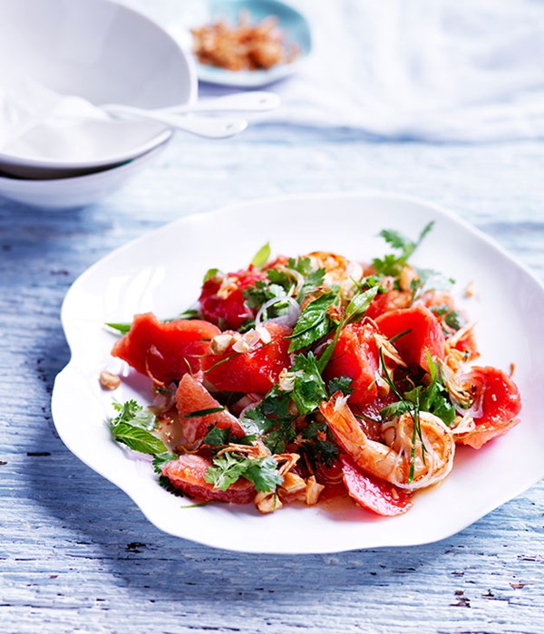 Sweet and sour watermelon salad with pink grapefruit and prawns