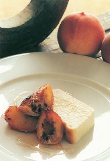 Sweet baked ricotta with glazed peaches