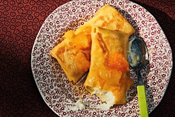 Sweet cheese blintzes with lemony apricot compote