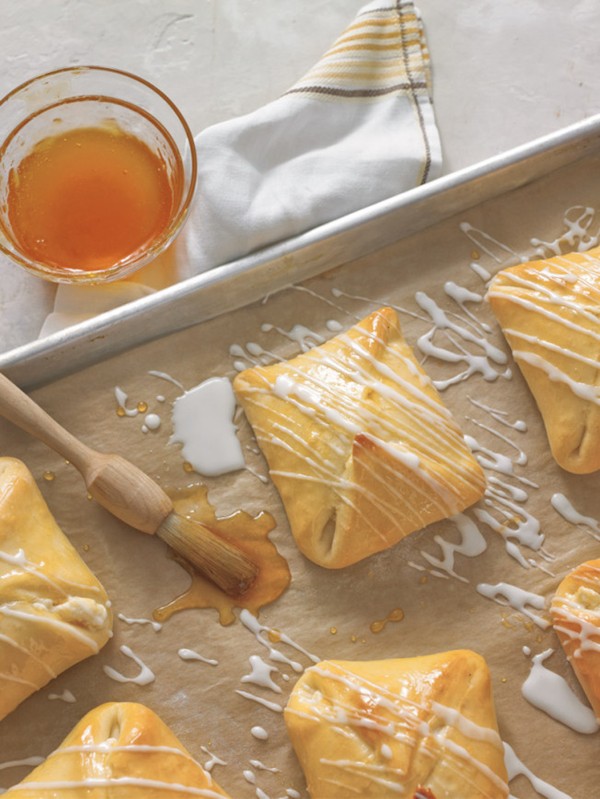 Sweet cheese pastries with apricot glaze