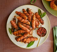 Sweet chilli-glazed pigs in blankets