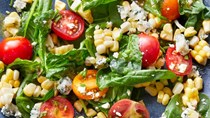 Sweet corn, tomato, and spinach salad with blue cheese