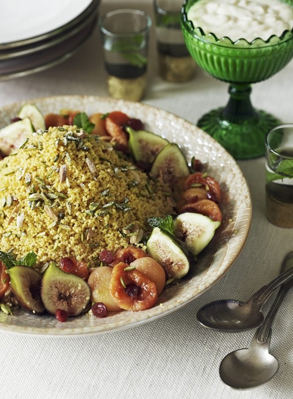 Sweet couscous with almond cream and poached fruits