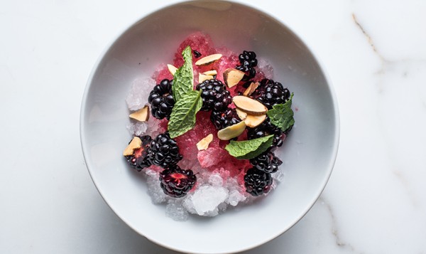 Sweet granita with blackberries, toasted almonds, and mint