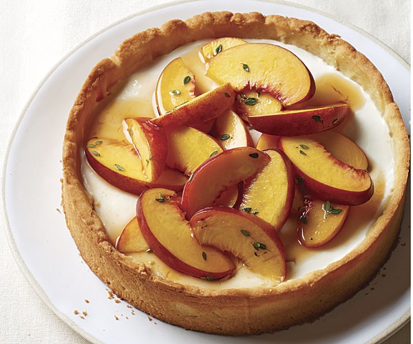 Sweet marinated peach tart with honey-yogurt mousse