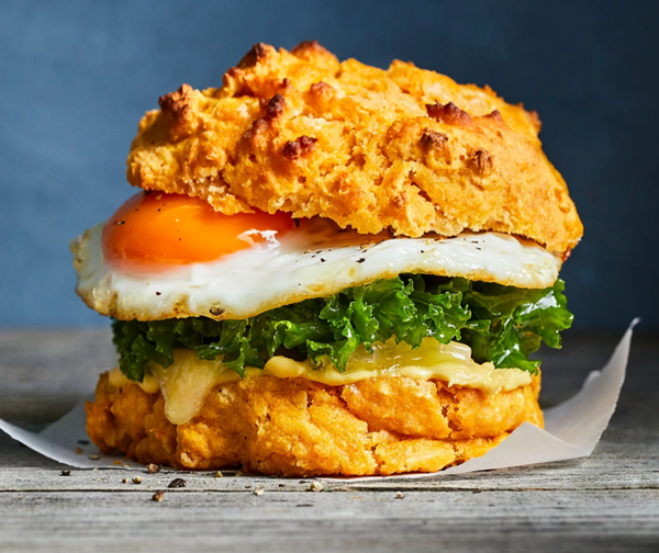 Sweet potato biscuit sandwiches with egg, kale & cheddar