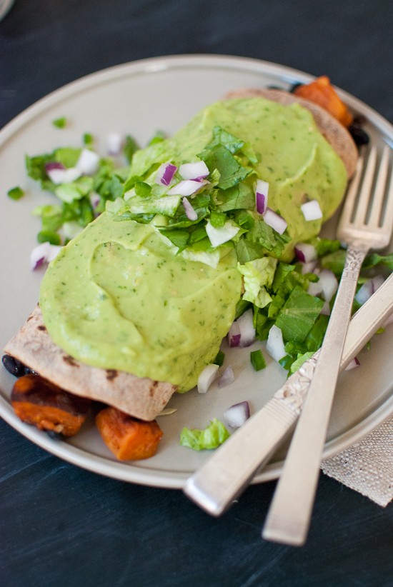 Sweet potato burrito smothered in avocado salsa verde