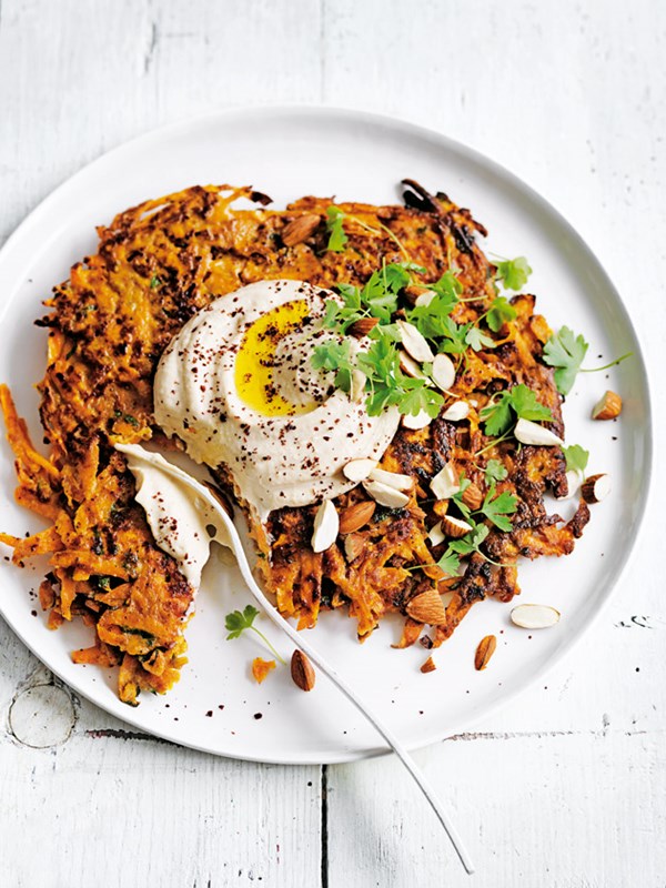 Sweet potato fritters with hummus and almonds