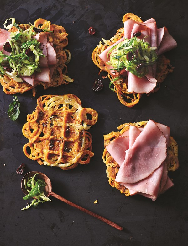Sweet potato hash brown open-face sandwich with ham and cranberry-Dijon Brussels slaw