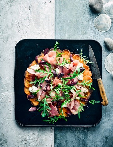 Sweet potato 'pizza' with olives and serrano ham 