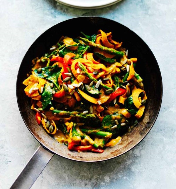 Sweet potato tagliatelle with roasted red pepper cream sauce and greens