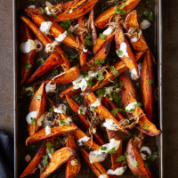 Sweet potato wedges with garlic and herb dressing, frizzled shallots and capers