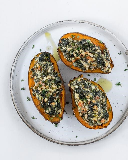 Sweet potatoes with spinach, feta cheese, and pine nuts