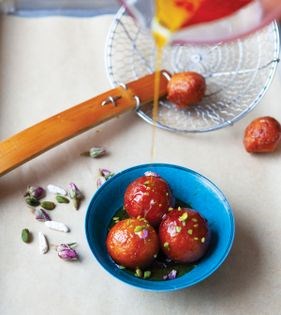 Sweet saffron-rose water glazed fritters (Golab jamun)