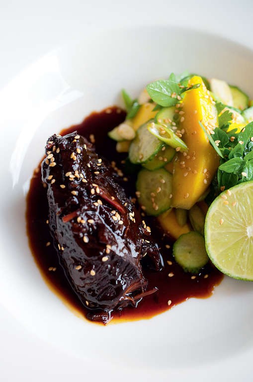 Sweet soy braised beef cheeks with mango salad