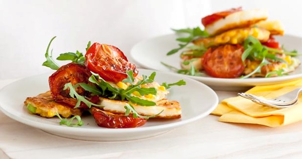 Sweetcorn fritters with tomatoes and halloumi
