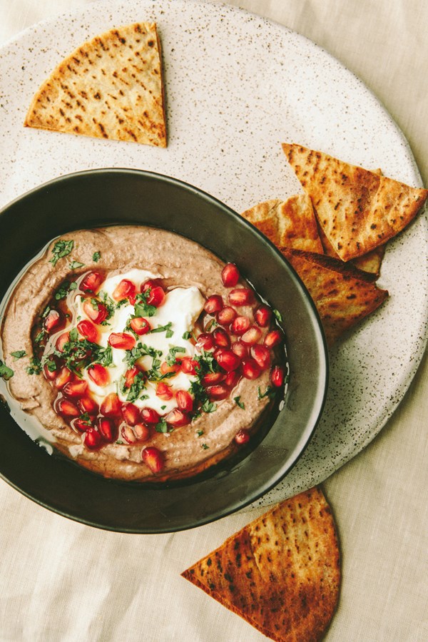 Sweetened black bean dip with yogurt and pomegranate