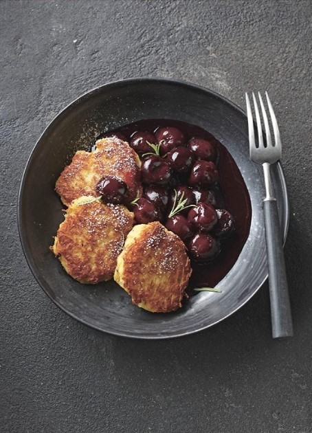 Sweetened potato fritters with rosemary-infused cherries