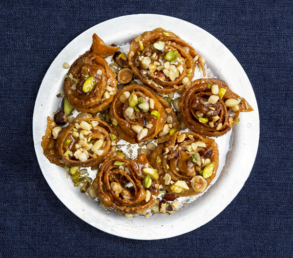 Syrup-soaked pastries with hazelnuts, pistachios, and pine nuts (Deblah)